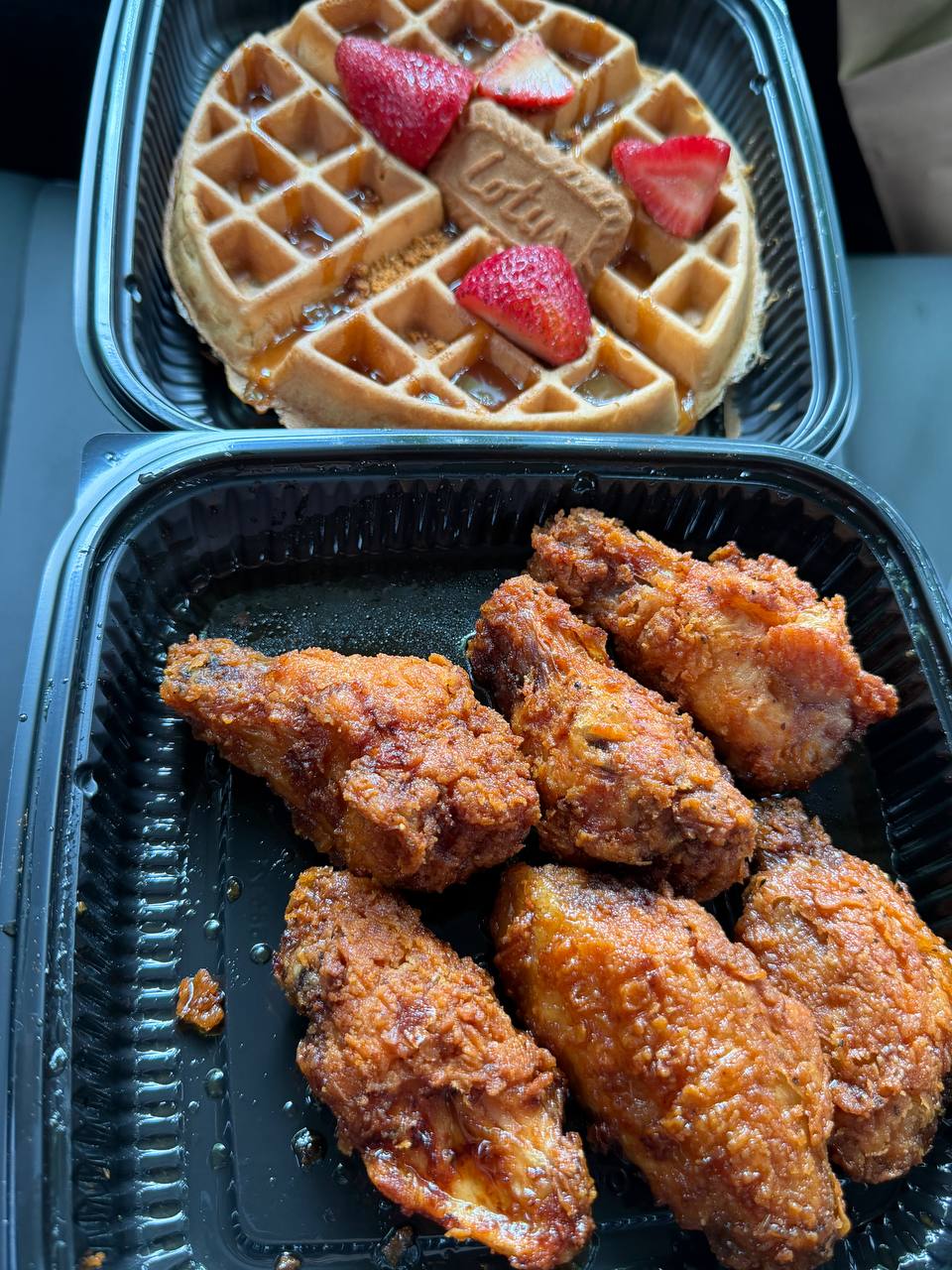 Waffle with strawberries and fried chicken wings
