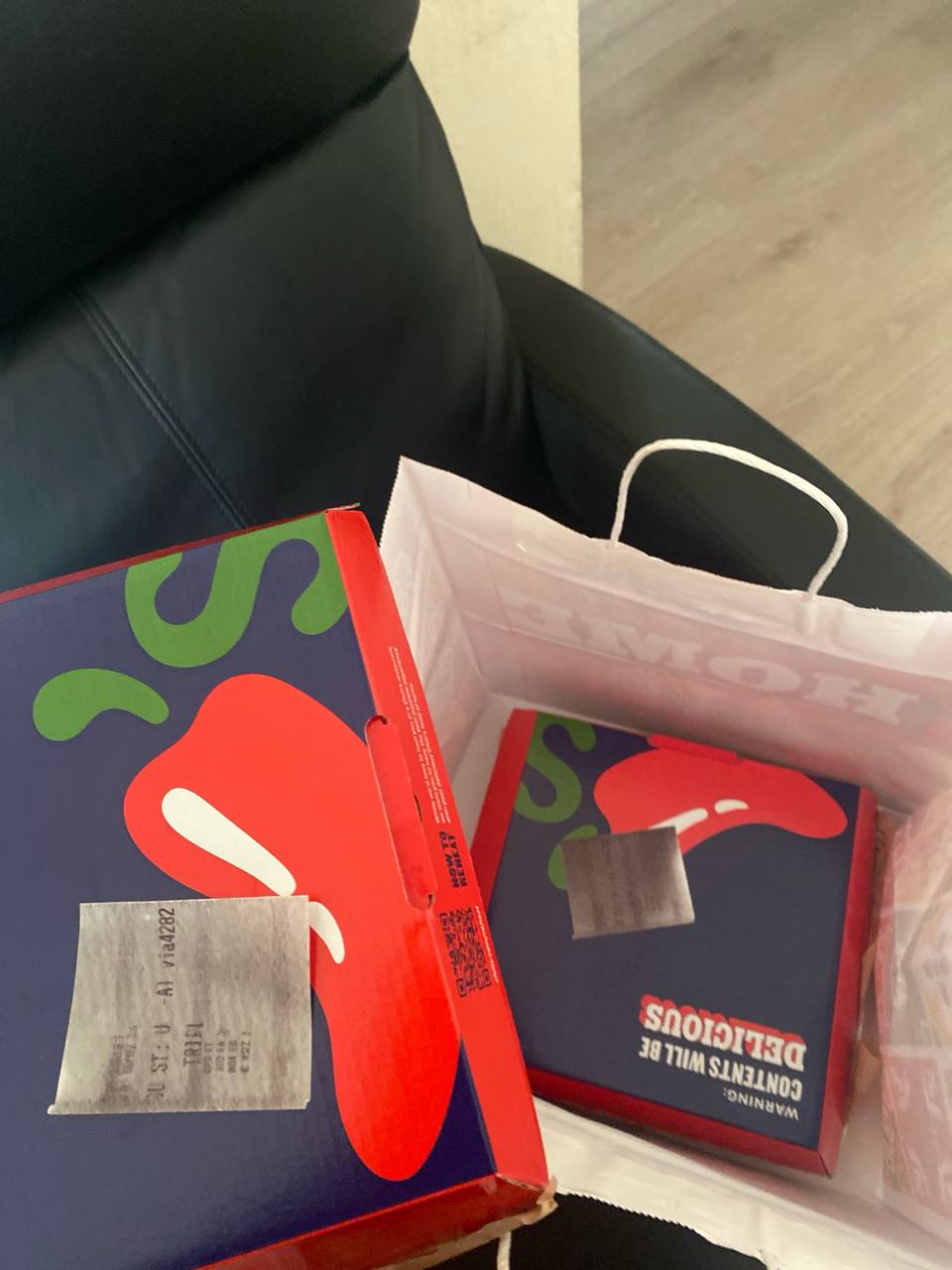 Hot chicken takeout boxes in a delivery bag