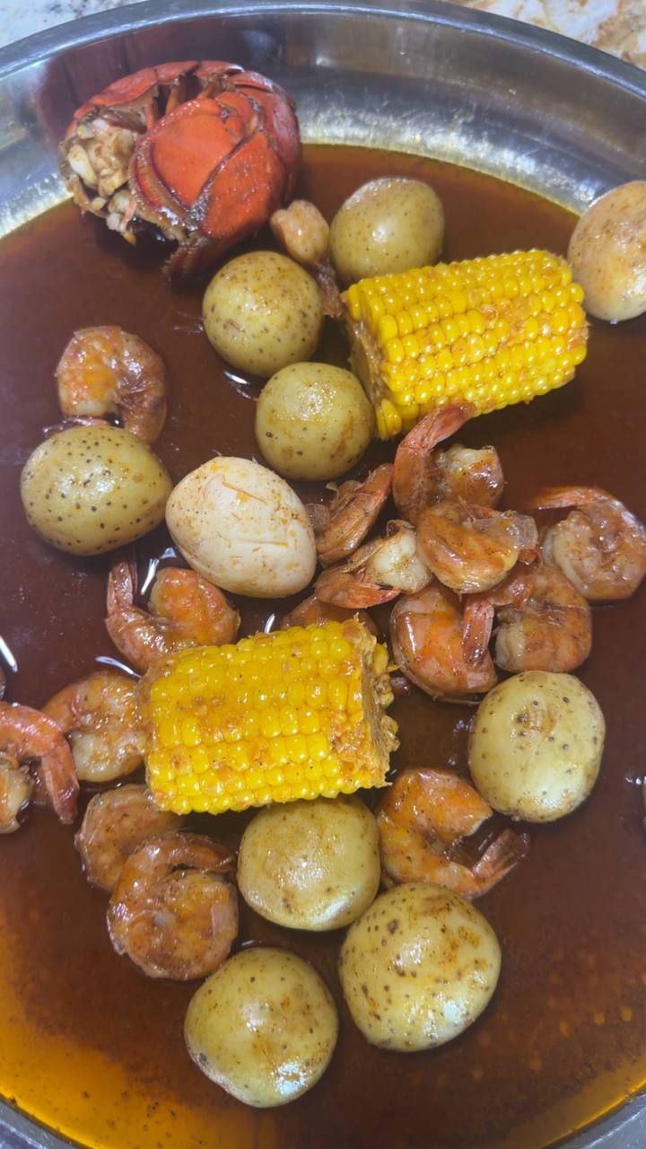 Seafood boil with lobster, shrimp, corn, and potatoes